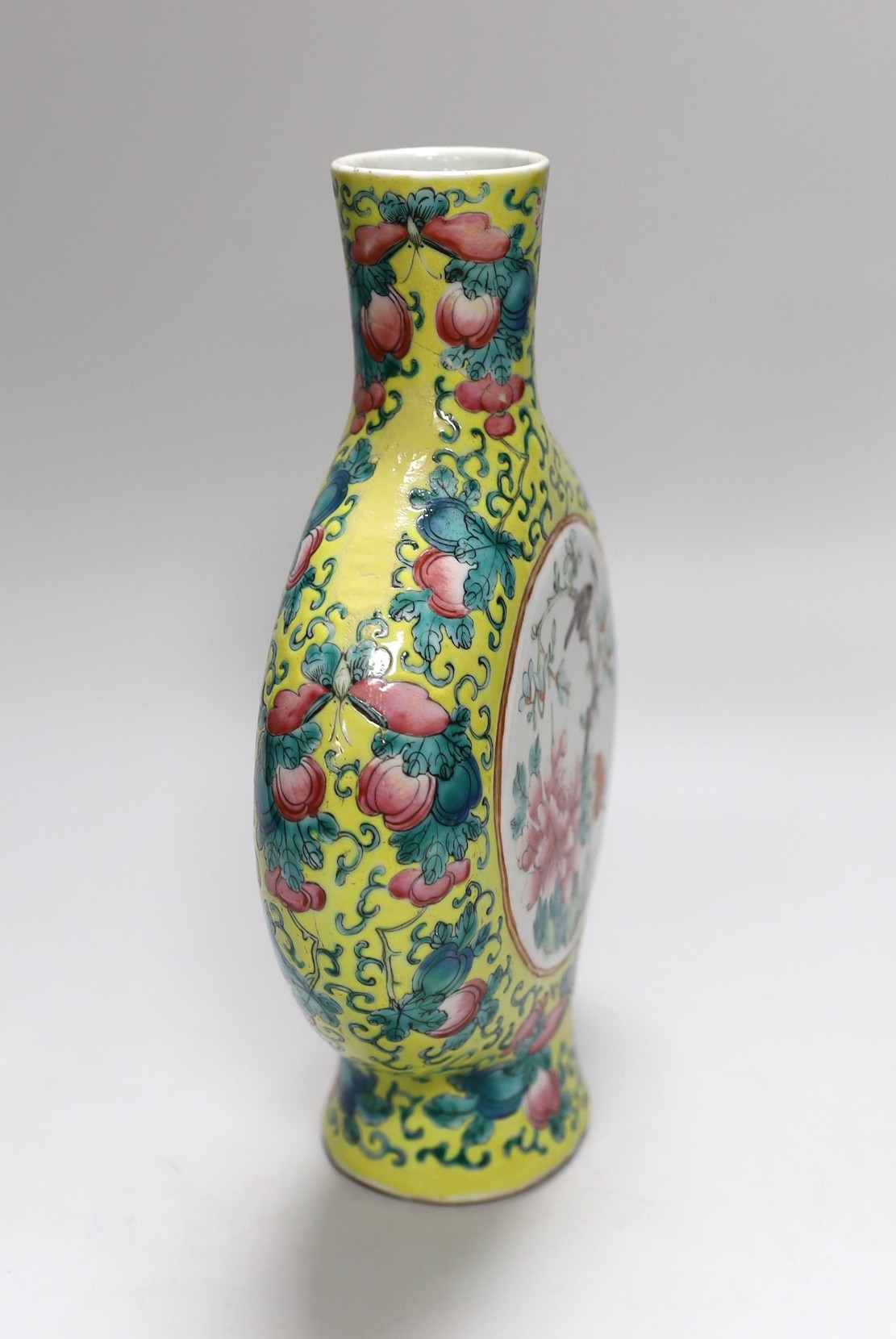 A Chinese yellow ground famille rose moonflask, late 19th century, neck a/f, 25cms high